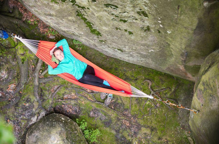 cheerful-young-woman-relaxing-in-hammock-near-P53DS6N - TAHAN Worldwide