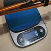Folded TriStick on a kitchen scale reading 225g