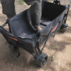 Adult standing inside the wagon bed showing the durable build