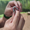 Carabiner clip, tightening and quick release of the guyline