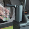 One press fills a glass of water from the TAHAN dispenser, then stops